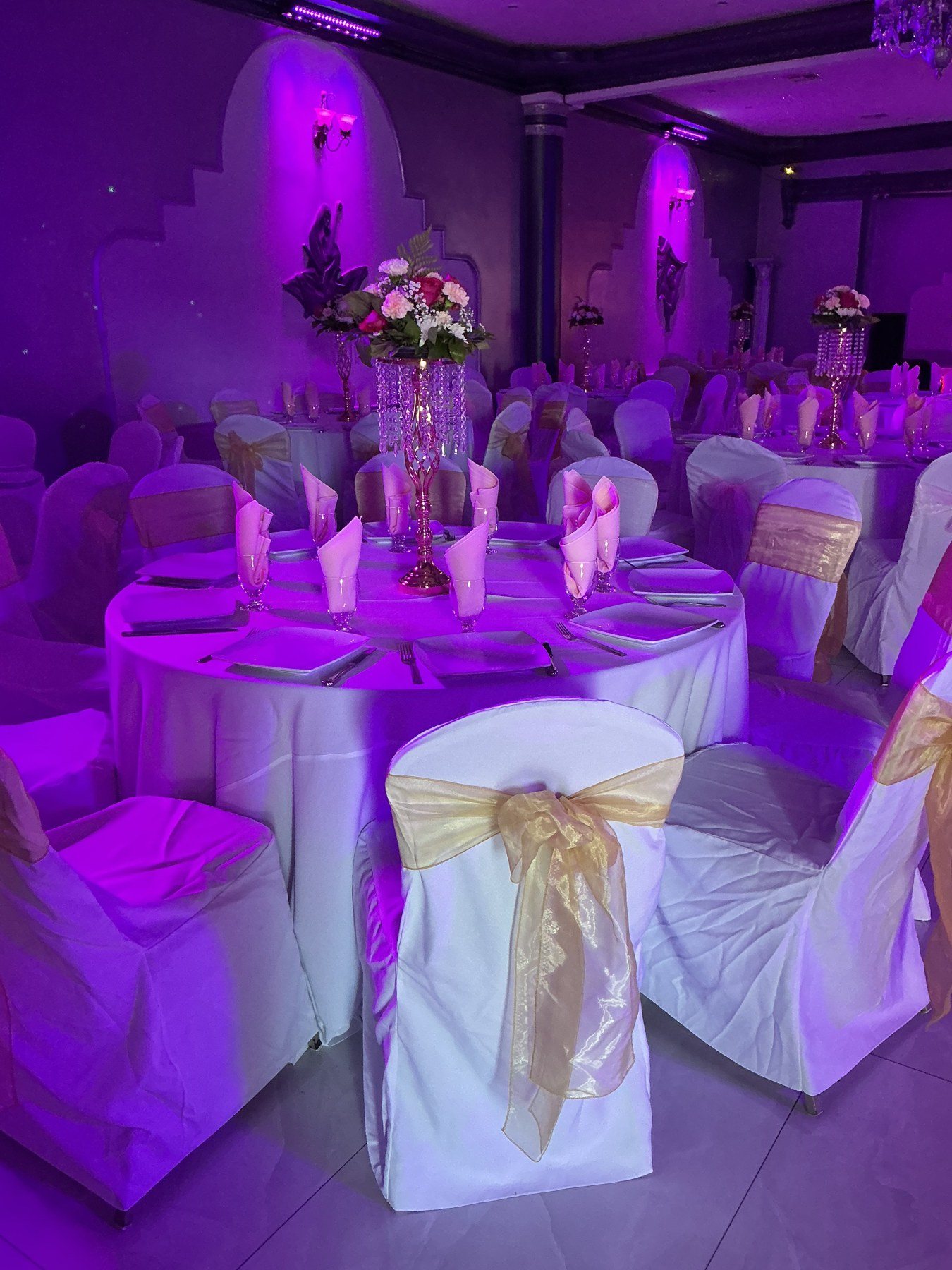 A table set under purple light